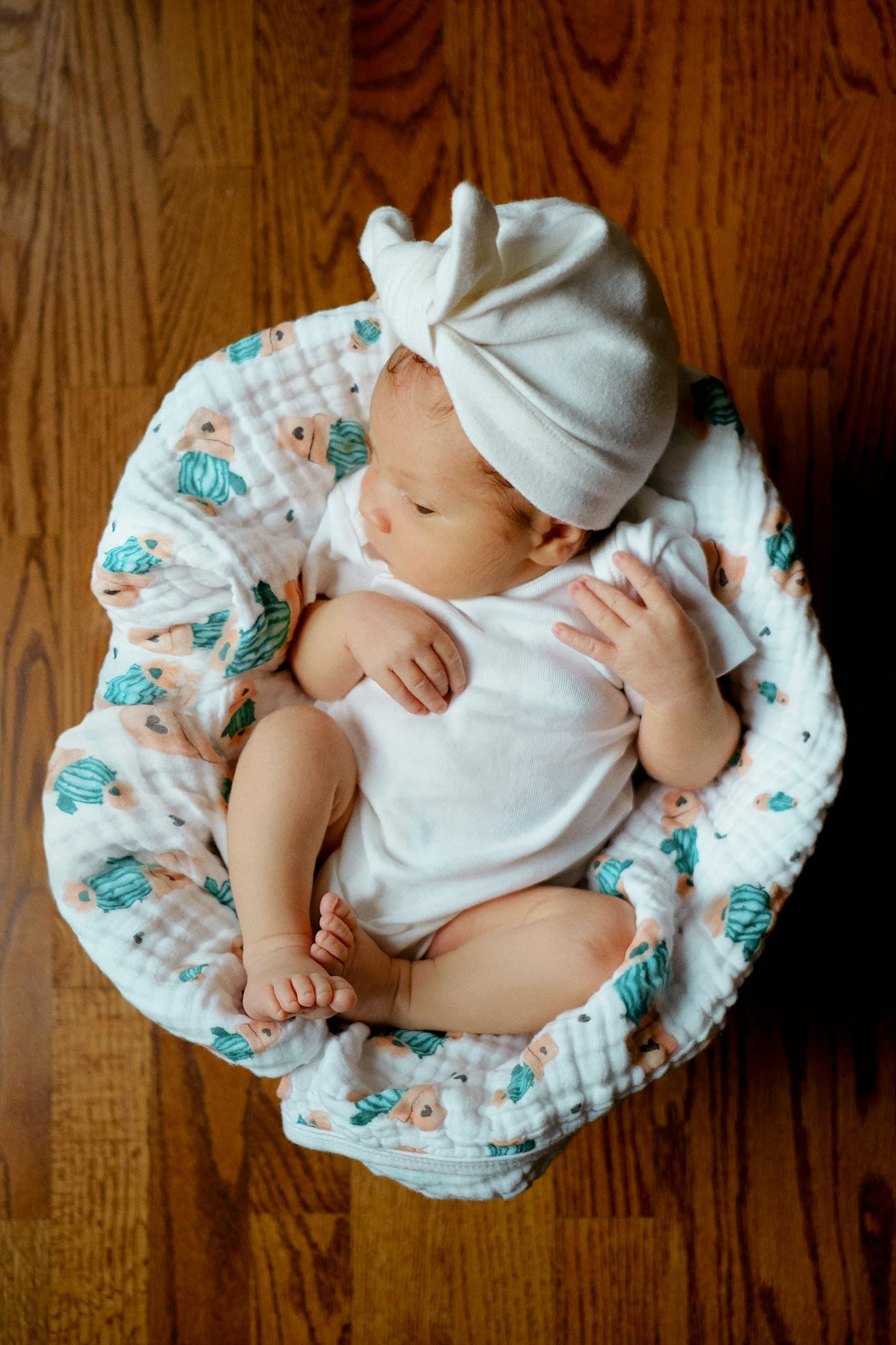 Baby asleep in a crib at the 4-month transition